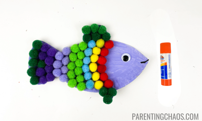 rainbow fish paper plate craft step 7: glue on the pompoms