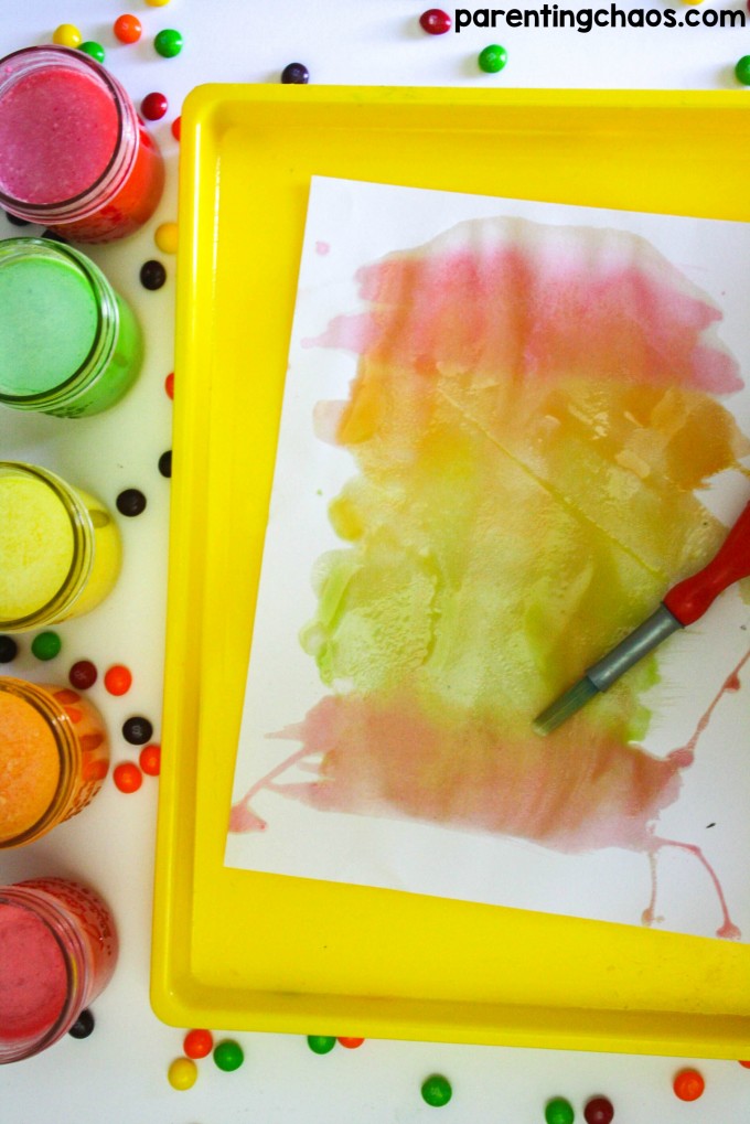 Make scented watercolors at home with these simple DIY Skittles Candy Paint! My kids loved playing with this scratch-n-sniff-paint!