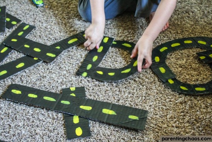 This DIY Alphabet Road Construction Kit will help your child learn their lower and upper case letters through hands on play!