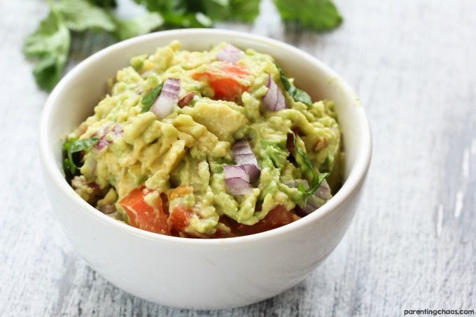Fresh Guacamole is one of those dishes that is easy to make and meets just about every diet out there (gluten free, dairy free, vegan, vegetarian, paleo, Whole 30, primal, etc). This makes it the perfect dish to bring for summer potlucks and get togethers. I promise - this quick and easy guacamole recipe is foolproof to make and bound to be a crowd-pleaser.