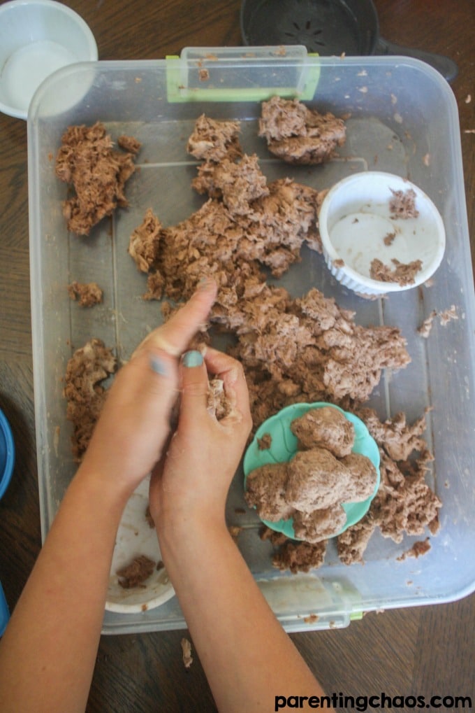 Ever had your child soak a roll of toilet paper? Instead of throwing it away turn it into this super fun Chocolate Scented Clean Mud!