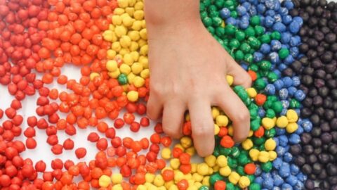Rainbow Dyed Chickpeas are a quick and easy sensory bin filler that kids will love!