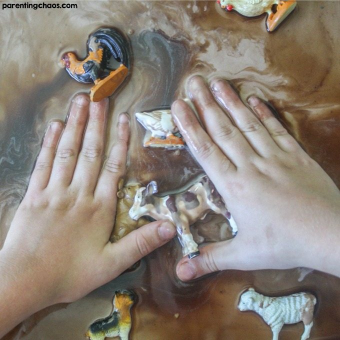 Sensory bins are a great activity for kids - easy, fun, and wonderful for developing fine motor skills. Your kids will love this simple Chocolate Mud Recipe!