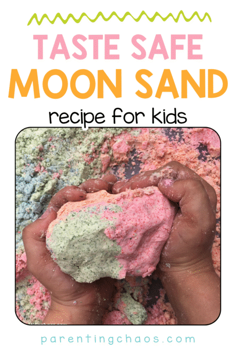 Taste safe moon sand recipe for kids. Child’s hands squeezing pink and green colored moon sand with blue, green, and pink moon sand spread across the background. Text reads: “Taste Safe Moon Sand Recipe for Kids – parentingchaos.com”.
