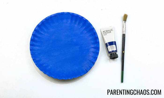 paper plate plane craft - paint the plate blue