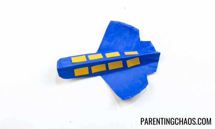 airplane paper plate craft - glue the windows on