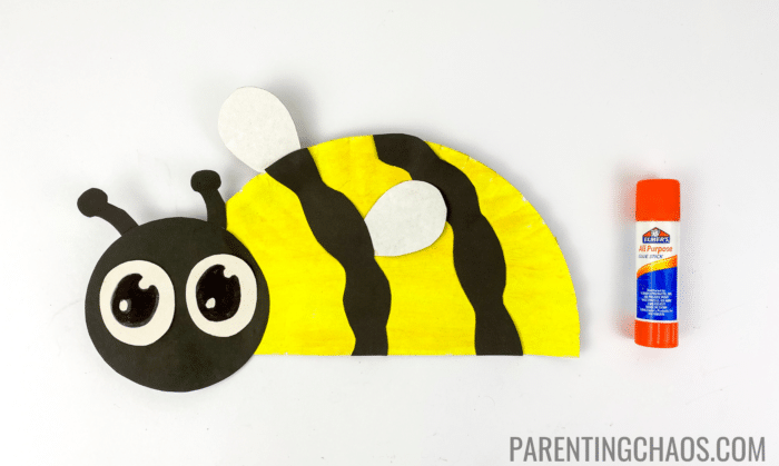 bee paper plate craft step 8 glue eyes on the face