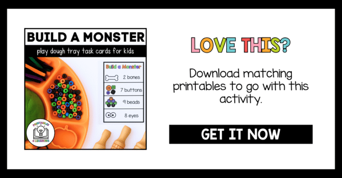 Promotional image with text “Build a Monster Play Dough Tray Task Cards for Kids” and “Download matching printables.” It shows the orange playdough tray with Halloween materials and rolling pins on the left and a colorful “Love This? Get It Now” banner on the right.