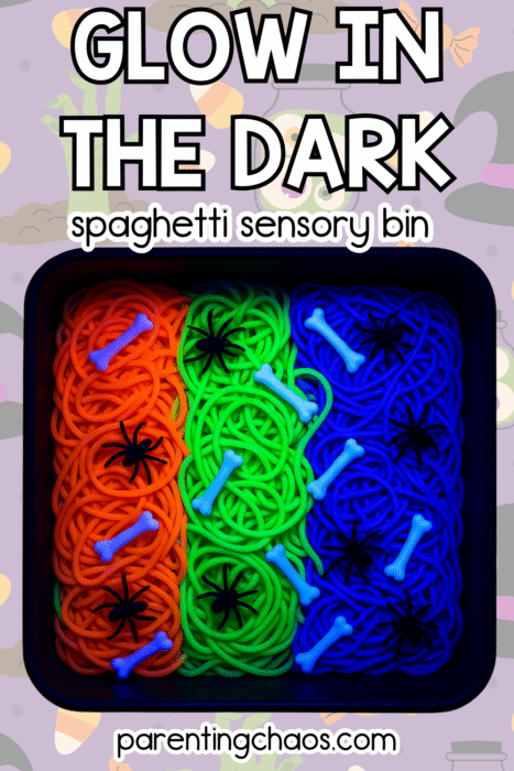 Neon spaghetti, bones, and spiders glowing brightly in a tray with playful Halloween background graphics.