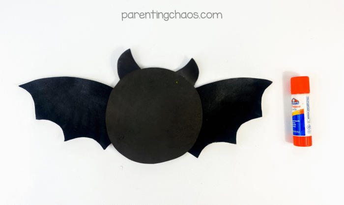 Ears glued to the top of the circular bat head.