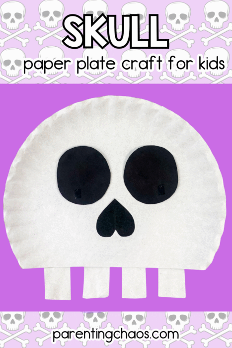 Skull paper plate craft for kids displayed on a purple background with a repeating skull pattern. The craft features big black eyes, a heart-shaped nose, and four teeth cut from the paper plate.