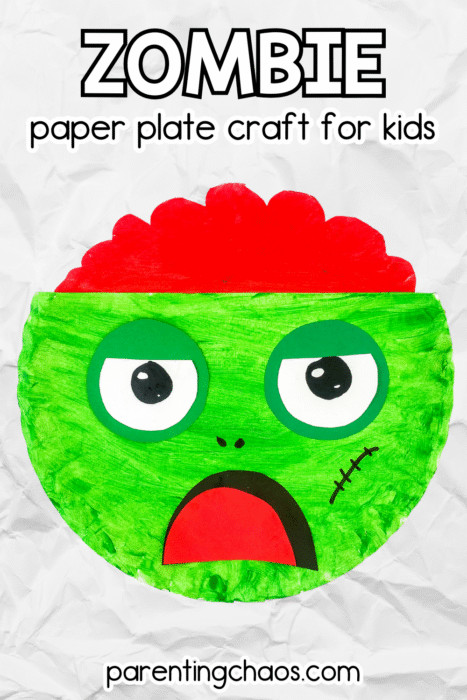 Colorful paper plate zombie craft for kids with green painted face, red brain top, and wide surprised mouth, displayed on a wrinkled white background. Fun Halloween art activity for preschoolers from Parenting Chaos.