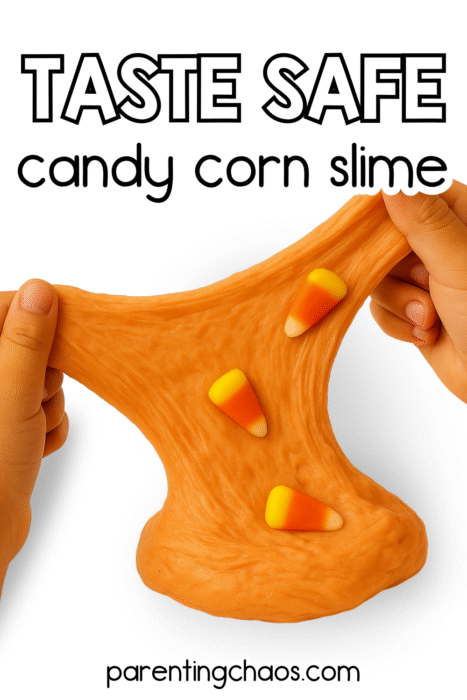 Kids stretching homemade orange candy corn slime on a white background.