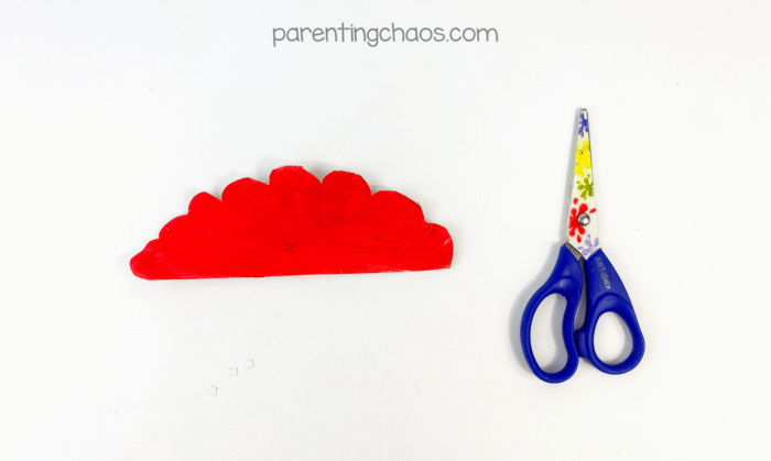 Red half-circle piece cut with scalloped edges for the zombie’s brain.
