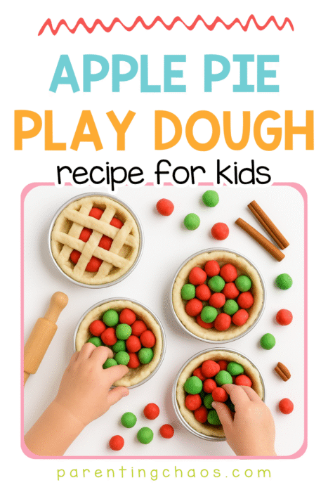 A child’s hands fill small pie tins with red and green play dough balls. One pie has a tan lattice top, and cinnamon sticks are placed nearby. Text reads “Apple Pie Play Dough Recipe for Kids.”