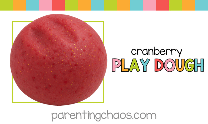 Cranberry playdough promotional image — smooth red dough ball with gold glitter and the Parenting Chaos logo.