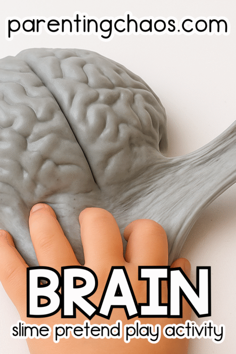 Child stretching gray brain-shaped slime between their hands during a sensory pretend play activity.
