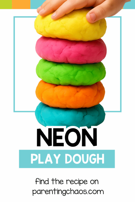 Child stacking bright neon playdough balls in yellow, pink, green, orange, and blue — simple DIY neon play dough recipe for preschoolers.