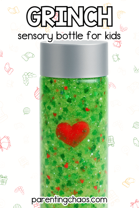 A close-up of a Grinch sensory bottle filled with green glitter and a red heart charm, displayed against a white background with Christmas doodles.