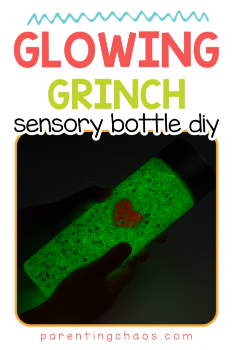 A glowing green Grinch sensory bottle being held in small hands, shown in the dark with a bright neon glow.