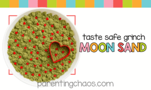 A large tray of green Grinch moon sand decorated with red heart sprinkles and a red heart cookie cutter, shown with text promoting the recipe.